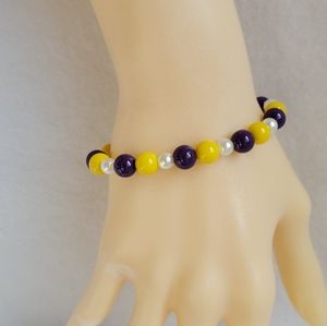 Womens purple, yellow, & white beaded stretch bracelet